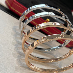 Bracelet jonc poli à détails vissés