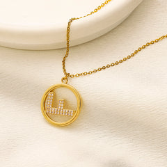 Collar con colgante circular de acero inoxidable 304 con motivo F pavé