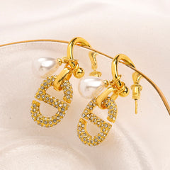 Aros con charm ovalado de efecto perla y pavé en acero inoxidable 304