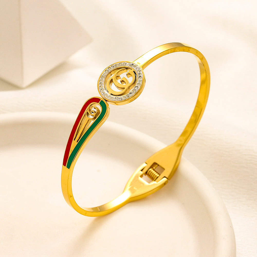 Brazalete rígido con monograma redondo y rayas de acero inoxidable 304