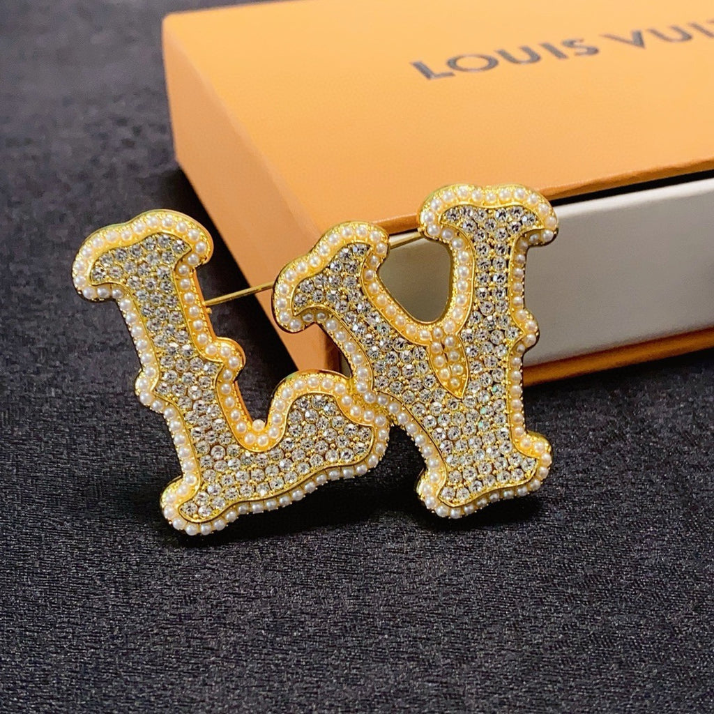Broche monogramme en lettres cursives texturées