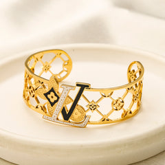 Bracelet jonc en acier inoxydable 304 à monogramme floral ajouré