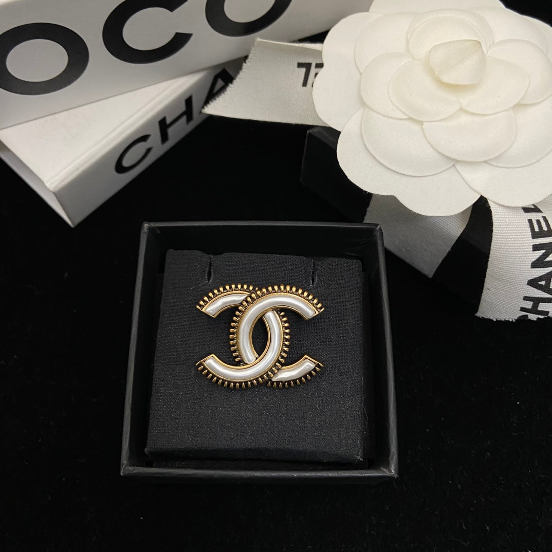 Curved Emblem Brooch with White Inlay