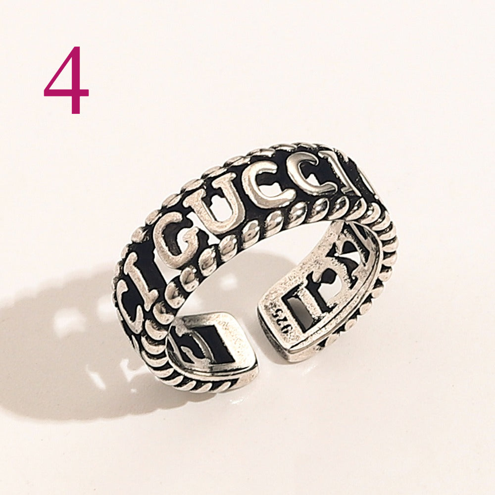Textured Open Band Ring with Interlocking Emblem