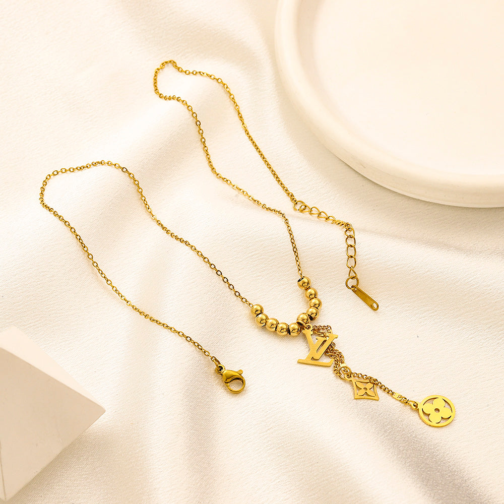 Collier Y avec pendentif monogramme floral en acier inoxydable 304