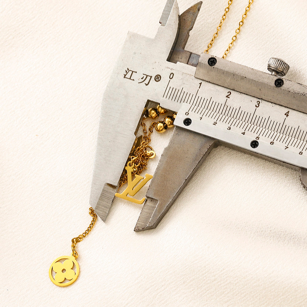Collier Y avec pendentif monogramme floral en acier inoxydable 304