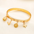Bracelet jonc multi-breloques monogramme en acier inoxydable 304