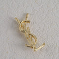 Broche con emblema de filigrana fina