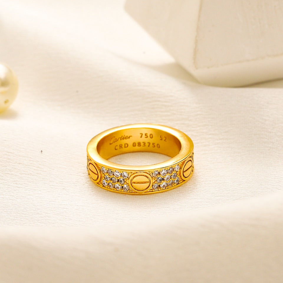 Bague anneau ornée de pierres et de vis apparentes