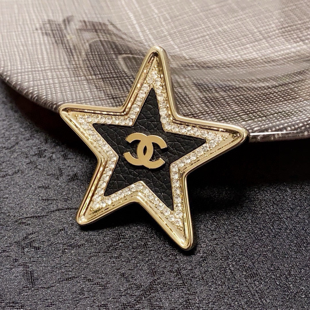 Broche de emblema de estrella abierta
