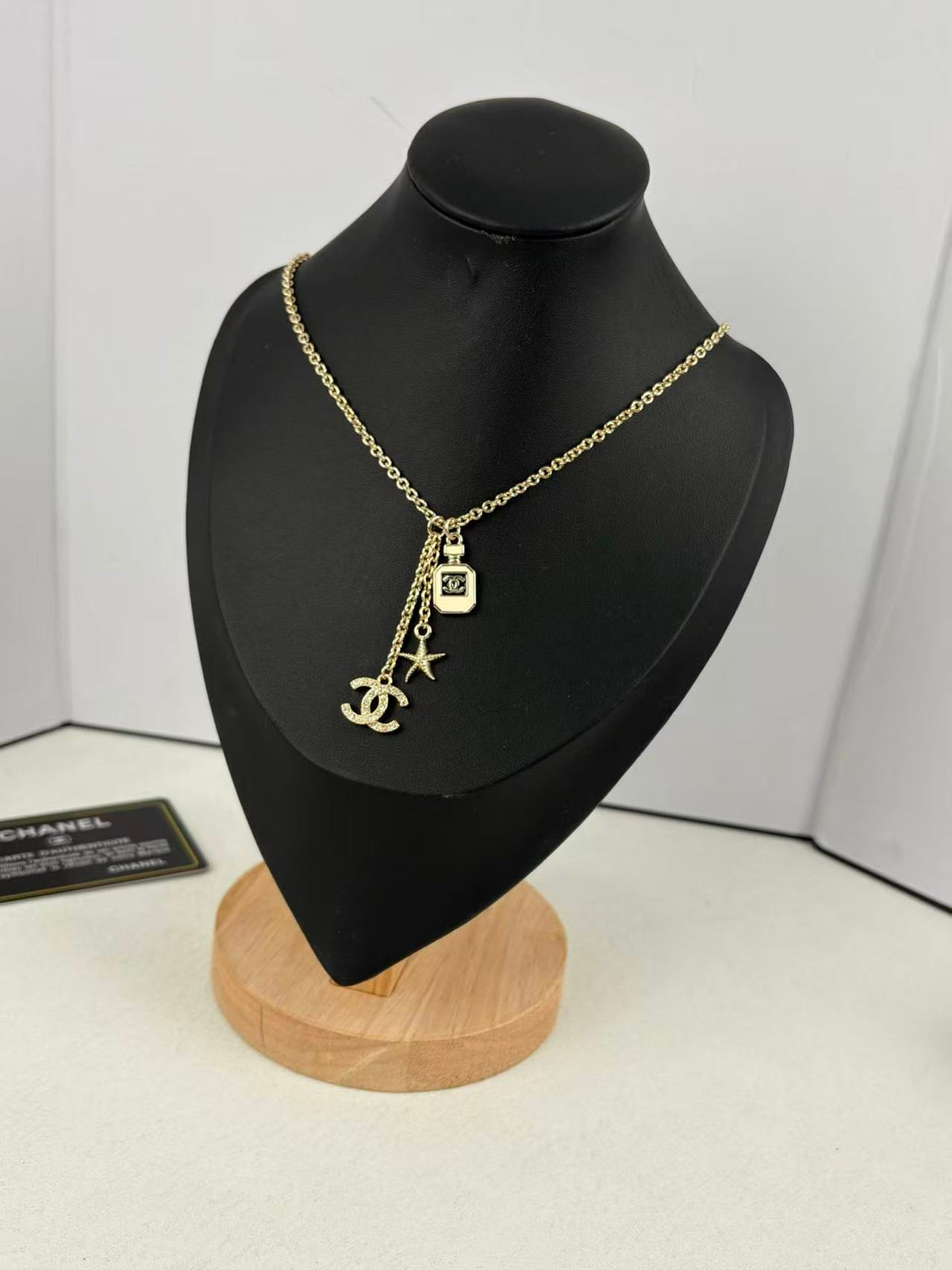 Gold Tone Multi-Charm Long Sweater Necklace, Perfume Bottle & Starfish Pendants