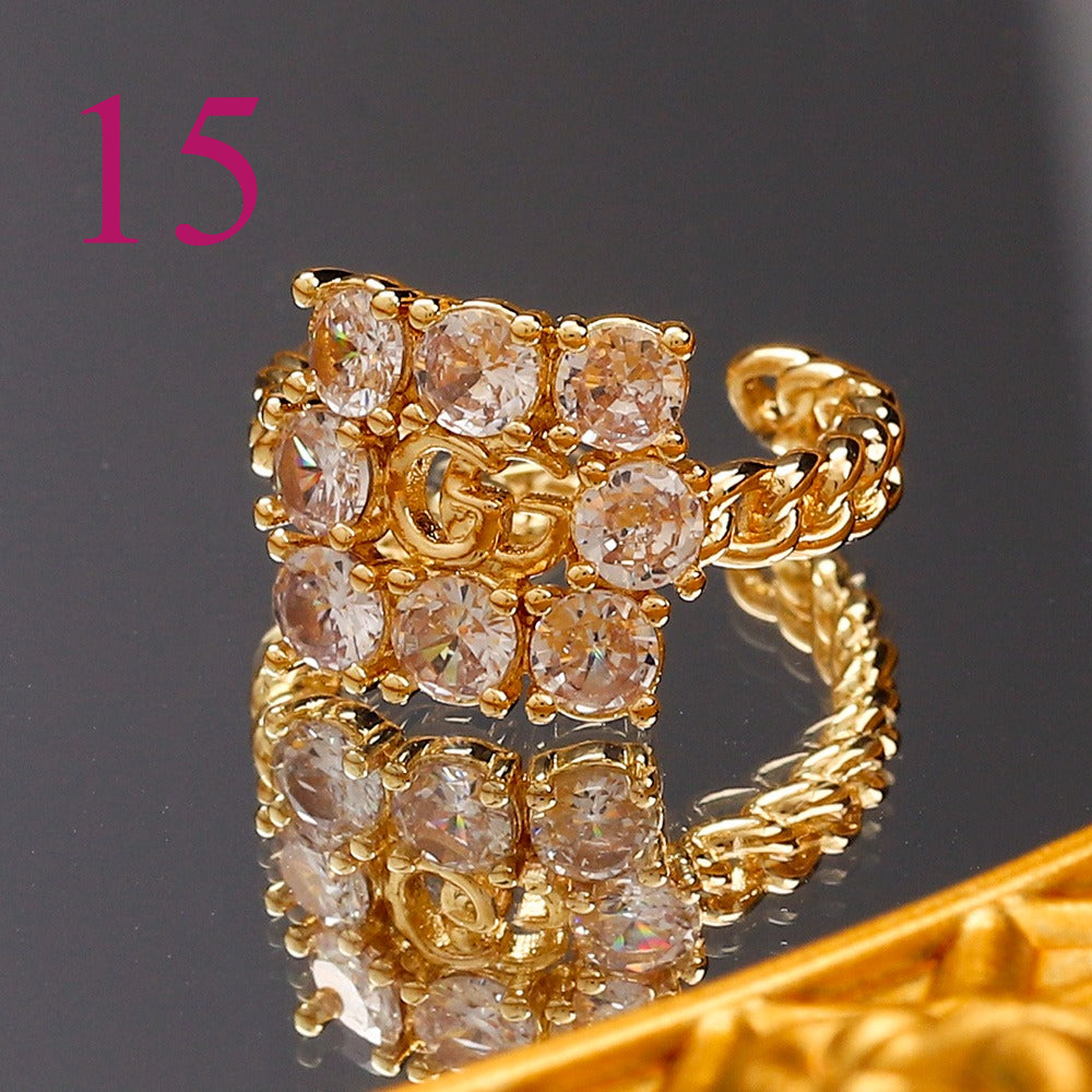 Textured Open Band Ring with Interlocking Emblem
