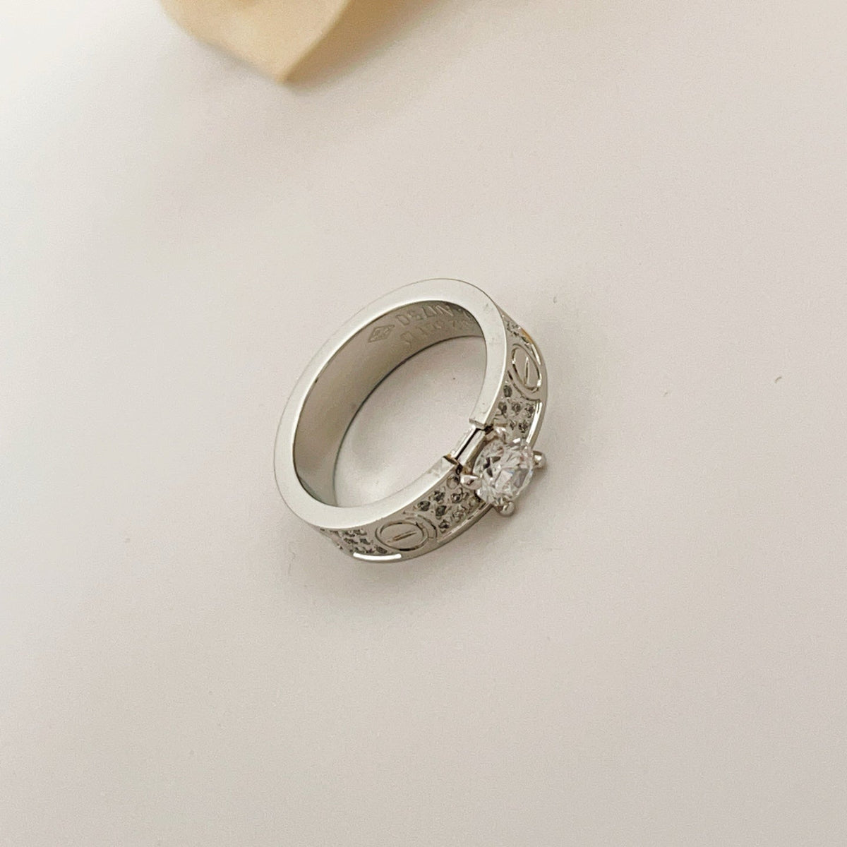 Silver-Tone Pave Screw-Detail Ring with Raised Stone