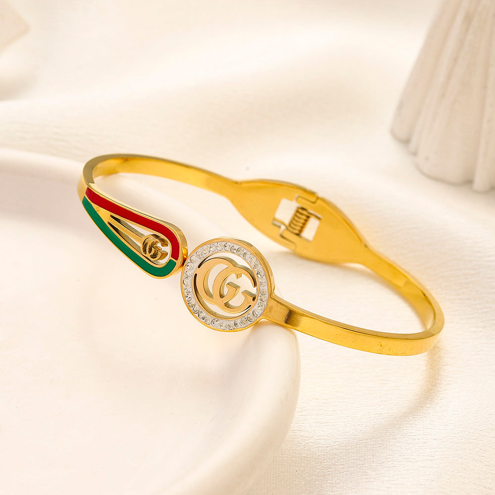 Brazalete rígido con monograma redondo y rayas de acero inoxidable 304