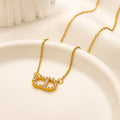 Collier pendentif ovale en cuivre pavé avec monogramme