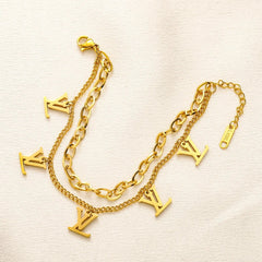 Pulsera de doble cadena con dije de monograma en acero inoxidable 304