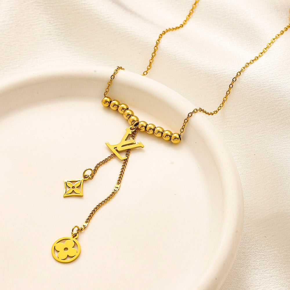 Collier Y avec pendentif monogramme floral en acier inoxydable 304
