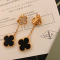Boucles d'oreilles pendantes à chaîne et motif quadrilobe noir