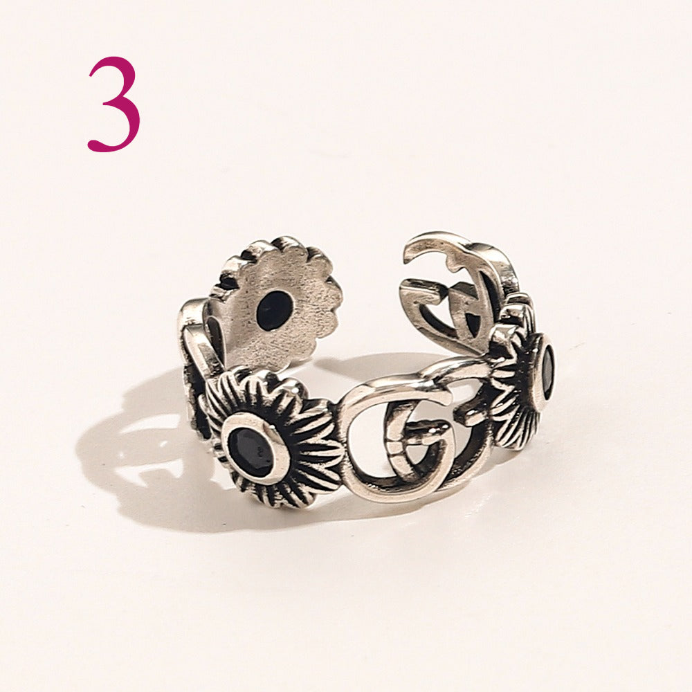 Textured Open Band Ring with Interlocking Emblem