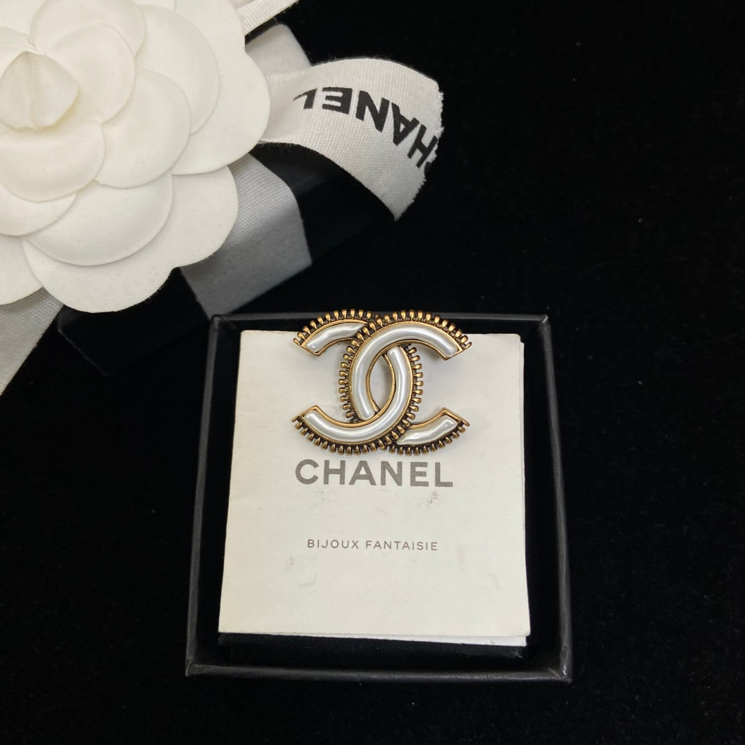 Curved Emblem Brooch with White Inlay