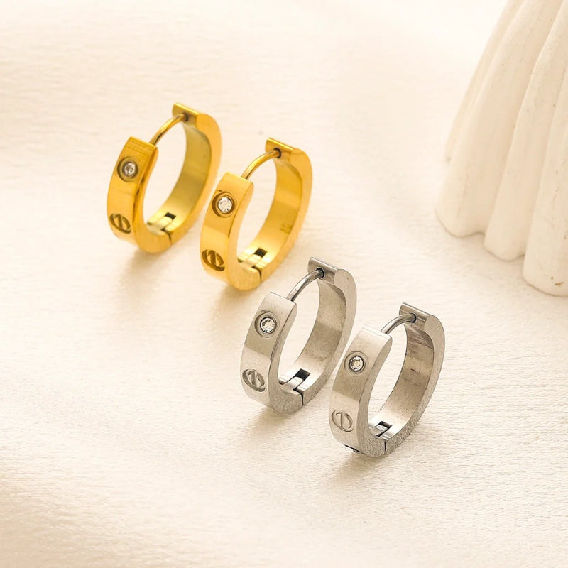 Pendientes huggie con detalle de tornillo en acero inoxidable 304