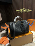 Embossed Monogram Top-Handle Barrel Bag — view 2