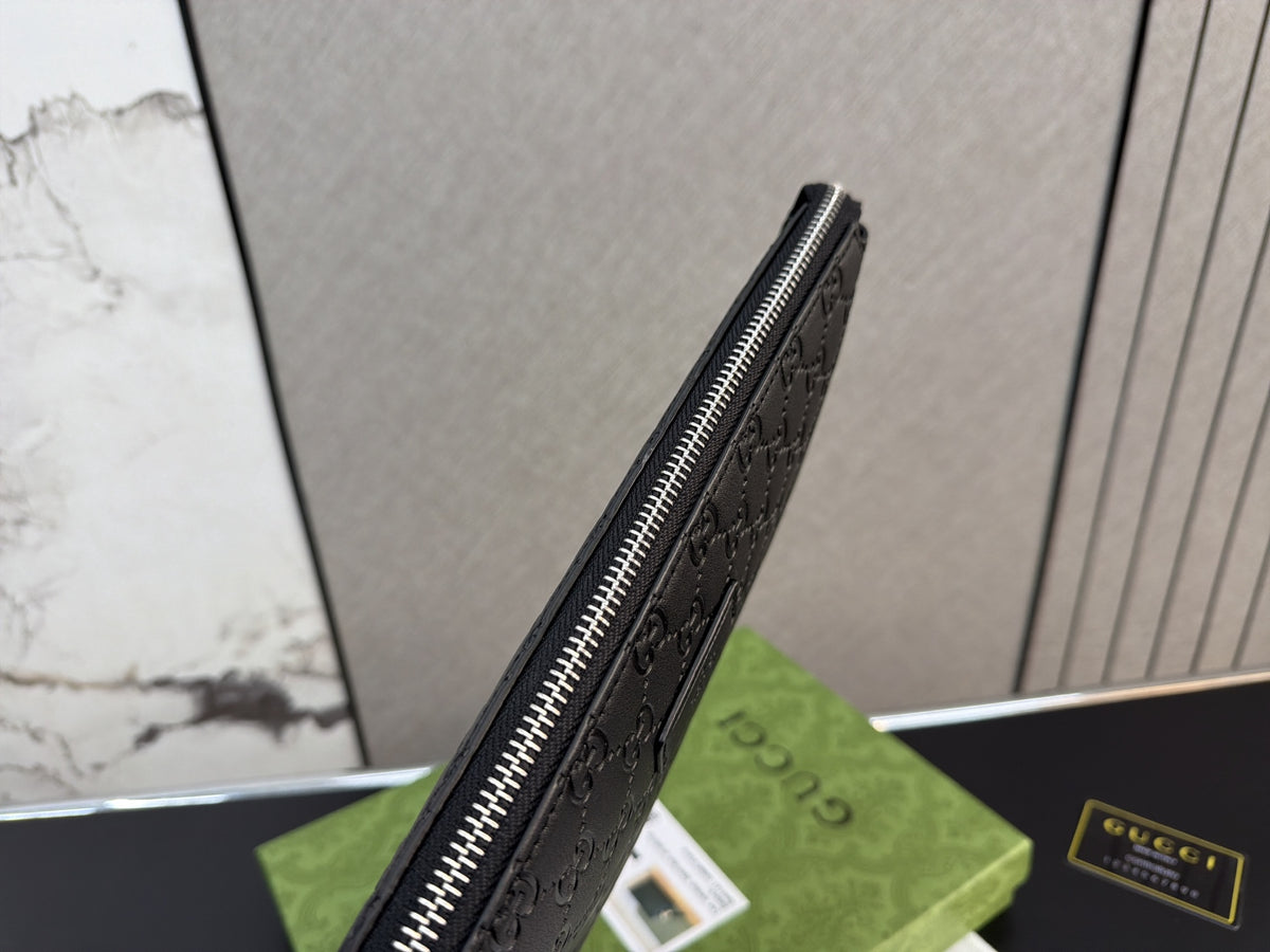 Black Embossed Monogram Zip Clutch — view 1