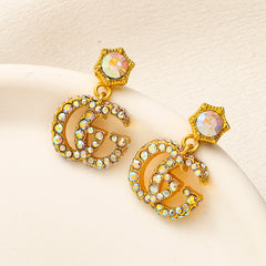 Pendientes colgantes con flores de acero inoxidable 304 y pavé, con eslabones en forma de G entrelazados