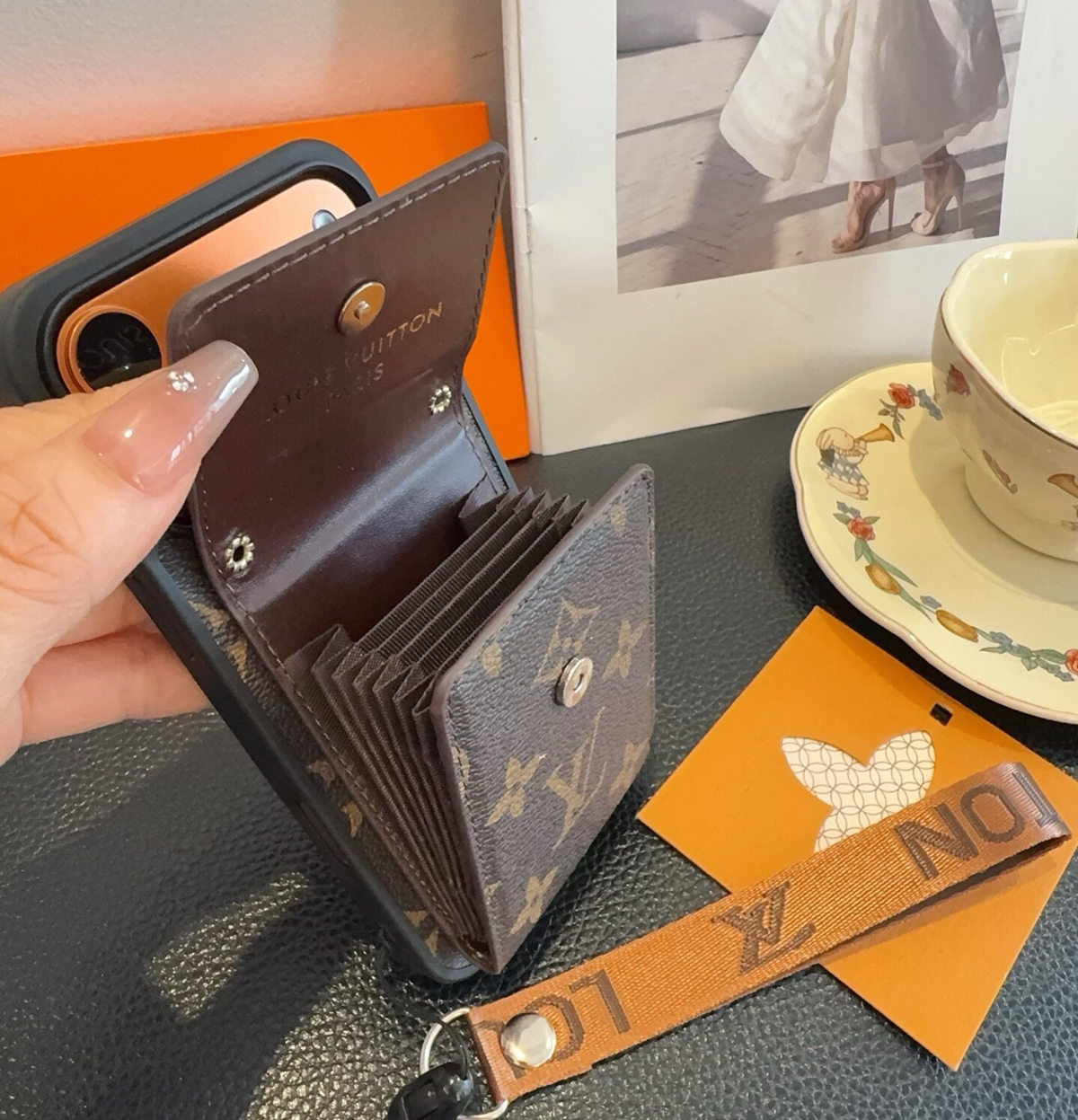 Brown monogram phone case with open accordion card pocket