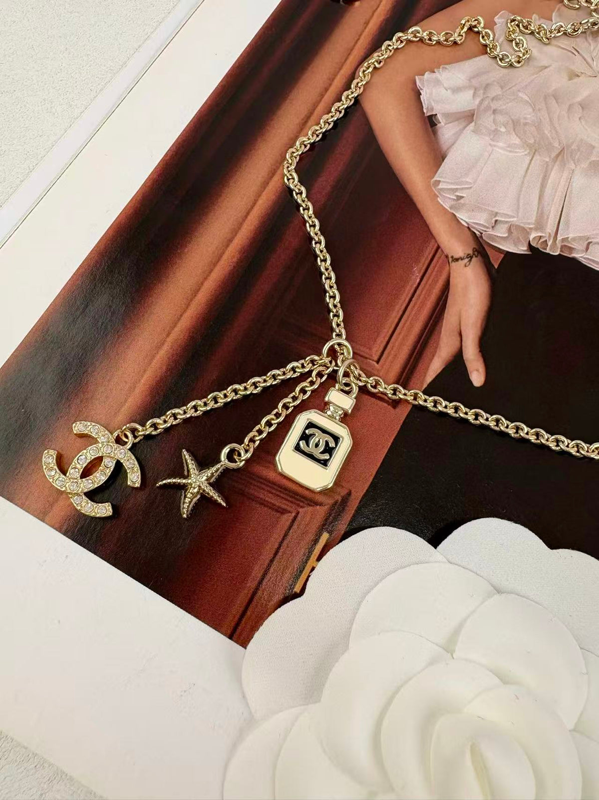 Gold Tone Multi-Charm Long Sweater Necklace, Perfume Bottle & Starfish Pendants