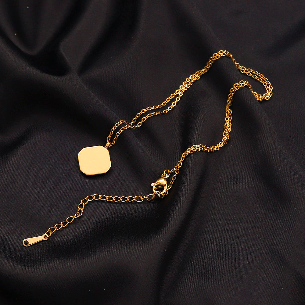 Collar octagonal con monograma e incrustación negra de acero inoxidable 304