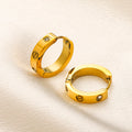 Pendientes huggie con detalle de tornillo en acero inoxidable 304