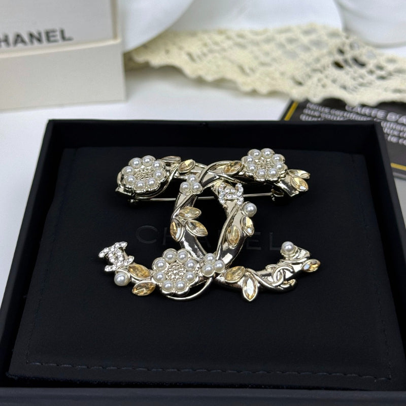 Floral Emblem Brooch with Stone Accents