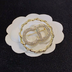 Twisted Round Frame Letter Brooch