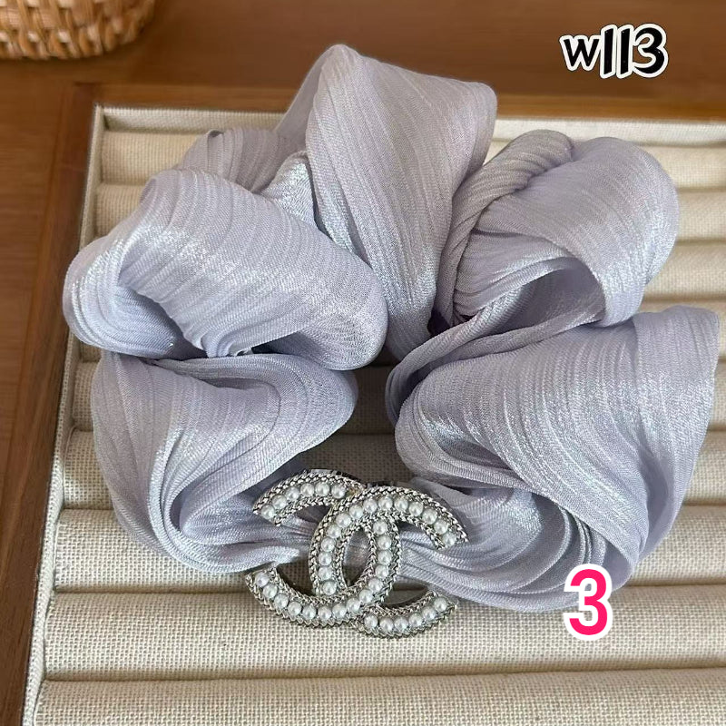 Sparkling Interlocking Emblem Hair Tie