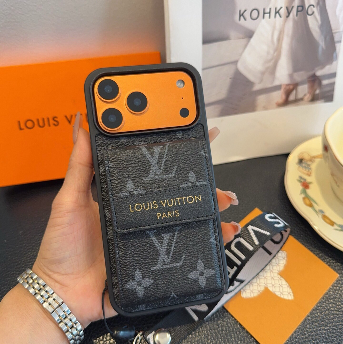 Black monogram phone case with flap card pocket and wrist strap, detail 1