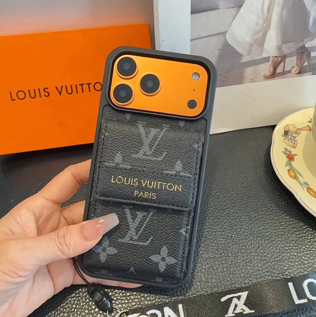 Black monogram phone case with flap card pocket and wrist strap, detail 8