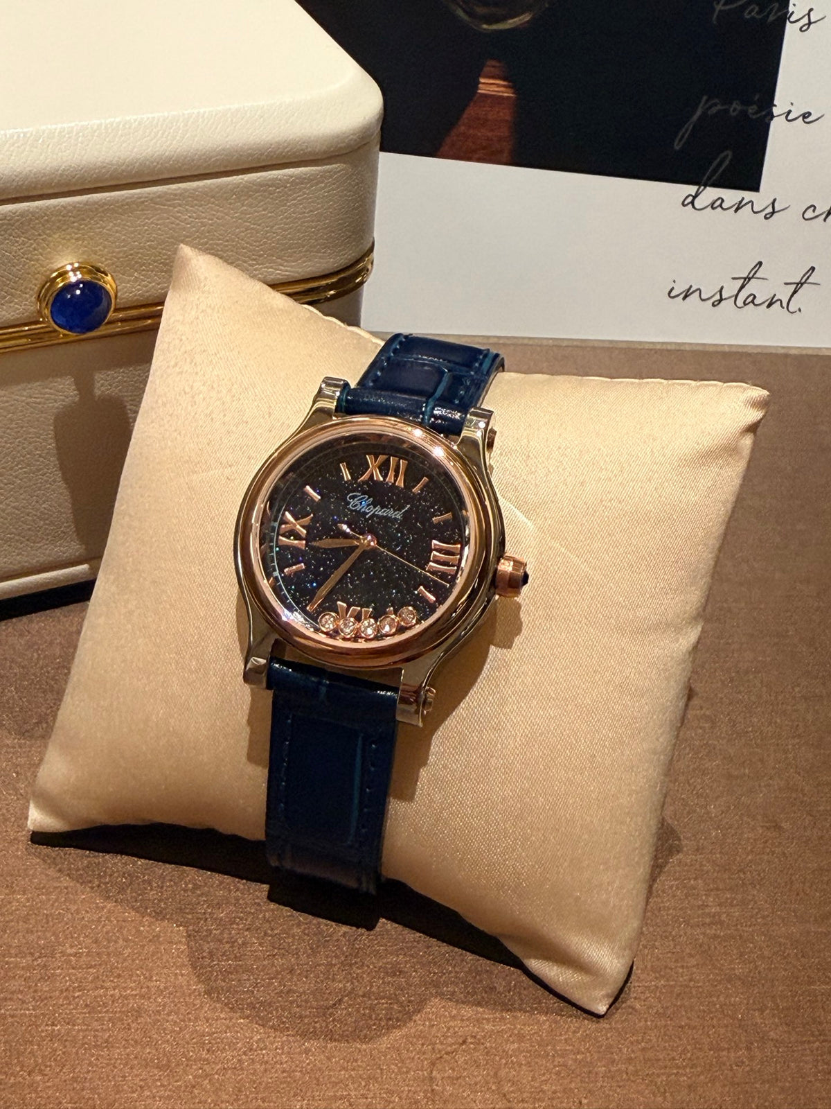 Navy strap gold-tone watch detail