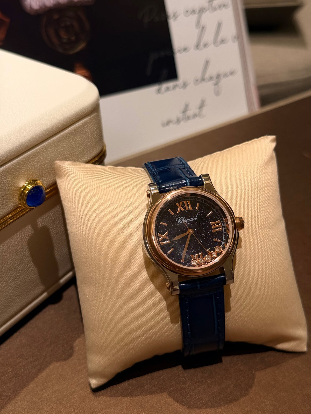 Navy strap gold-tone watch detail