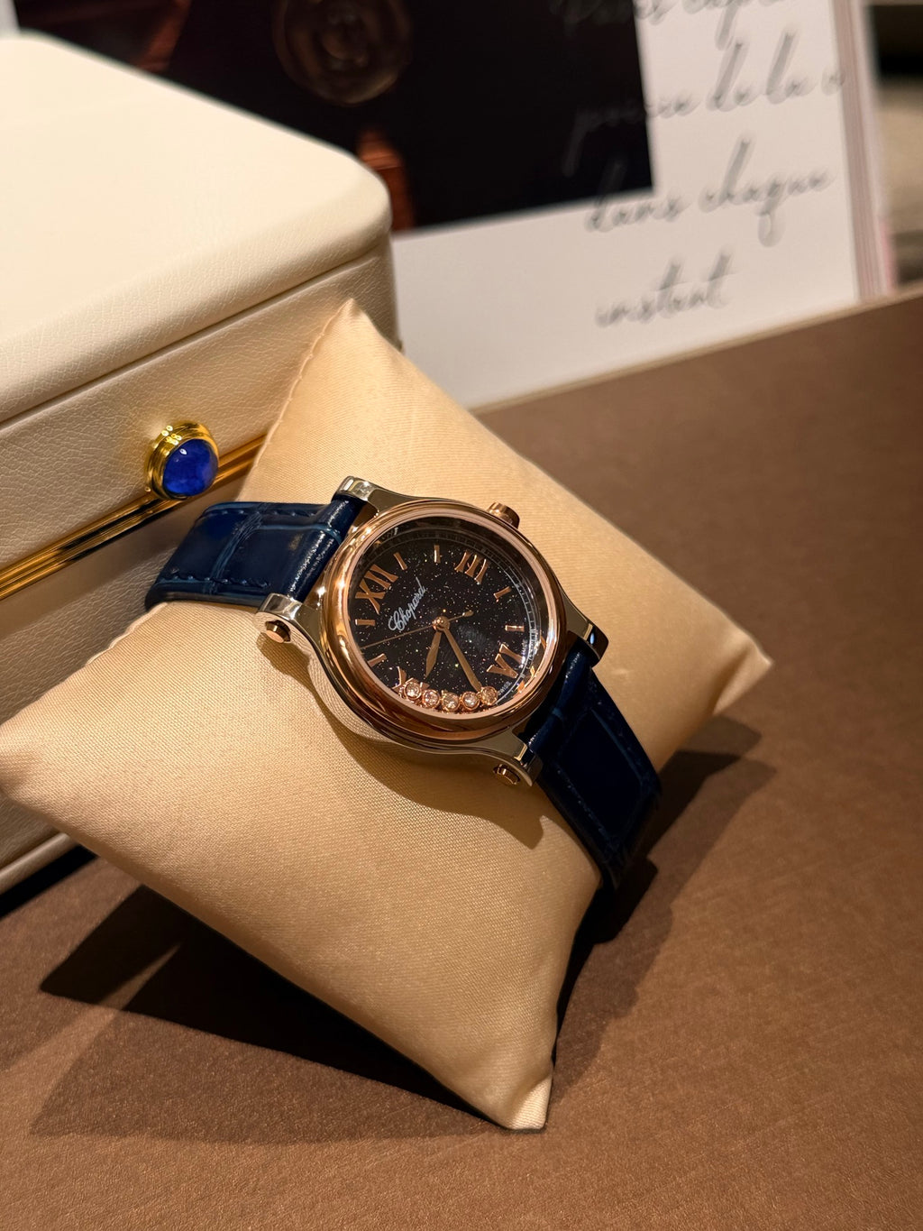 Navy strap gold-tone watch detail
