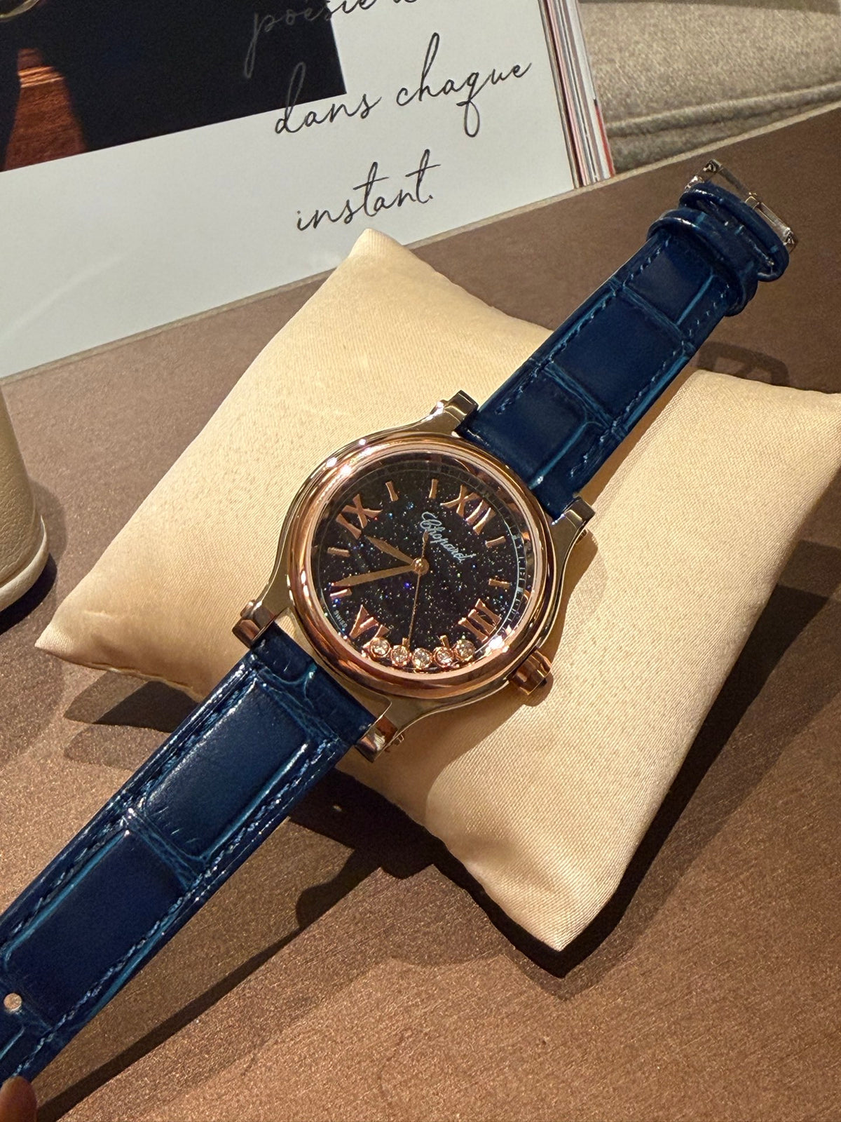 Navy strap gold-tone watch detail