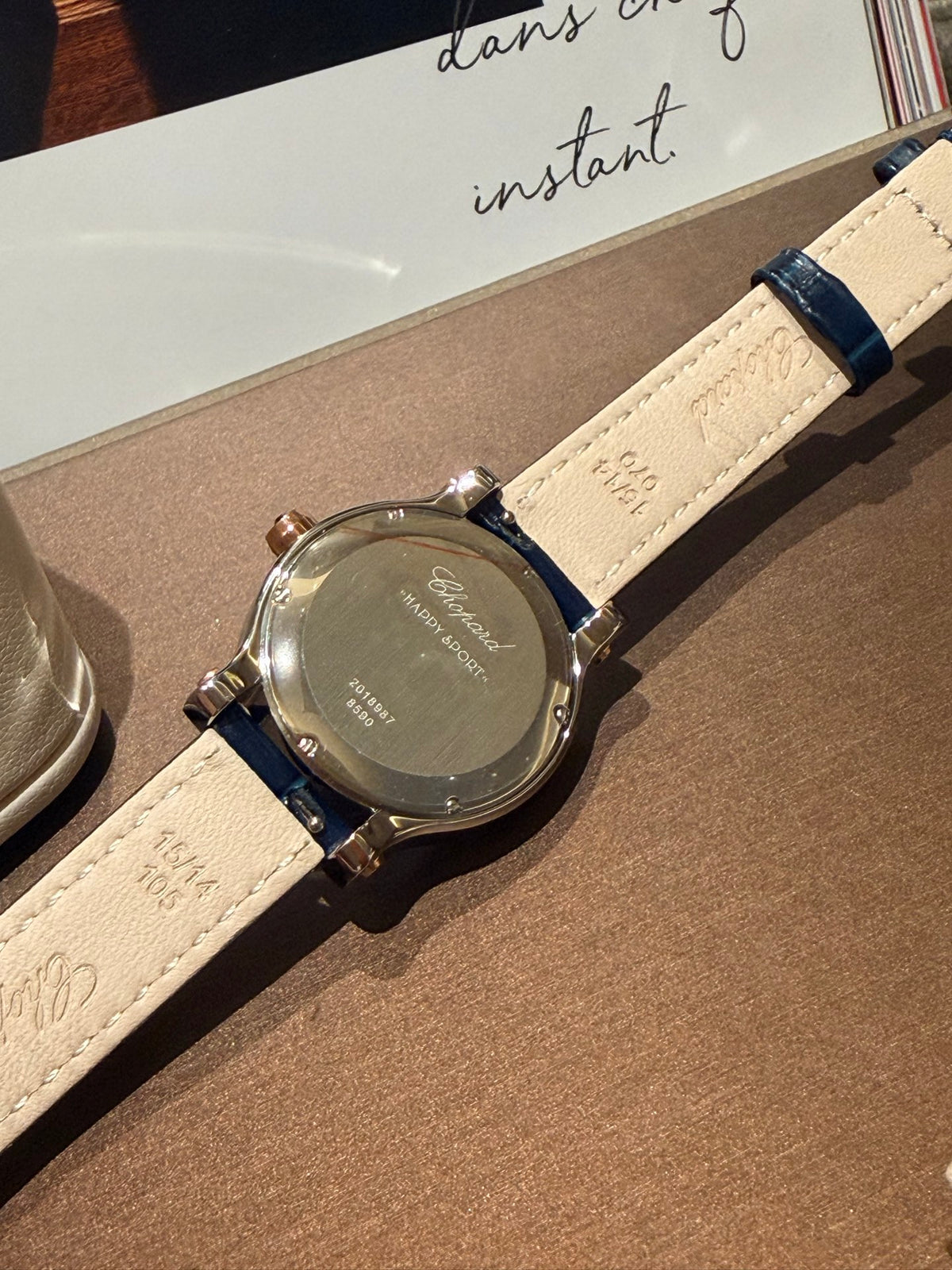 Navy strap gold-tone watch detail
