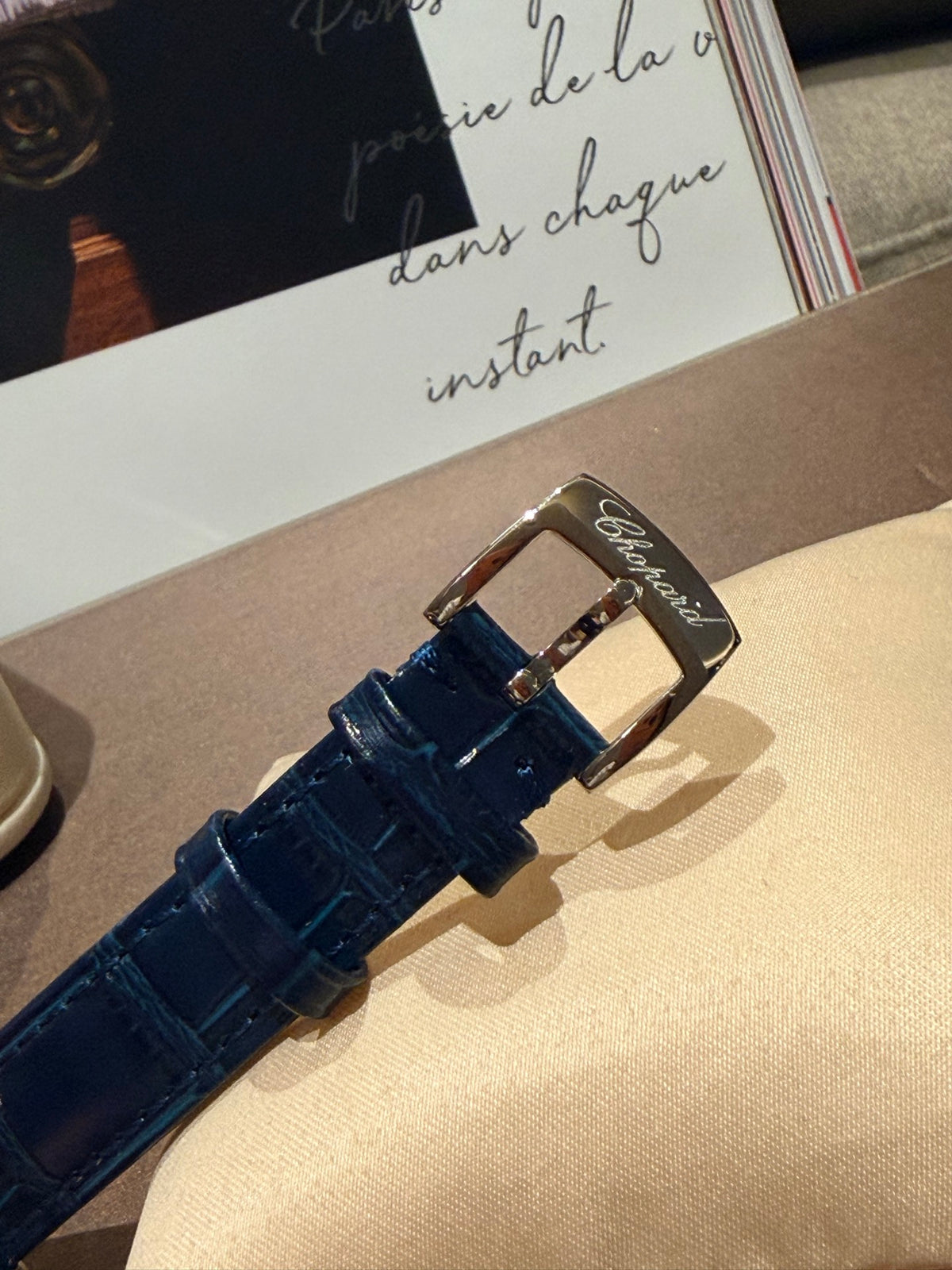 Navy strap gold-tone watch detail