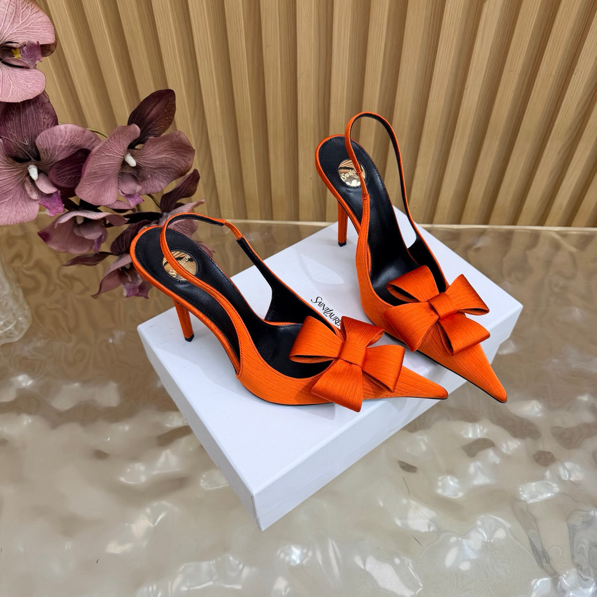 Orange bow-detail pointed-toe slingback heels