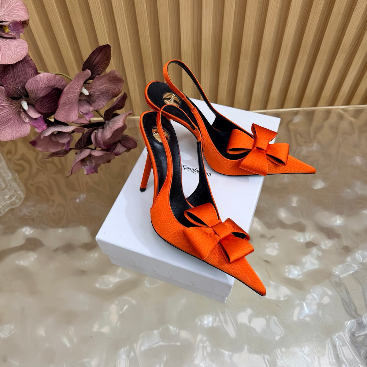 Orange bow-detail pointed-toe slingback heels