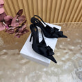 Black bow-detail pointed-toe slingback heels